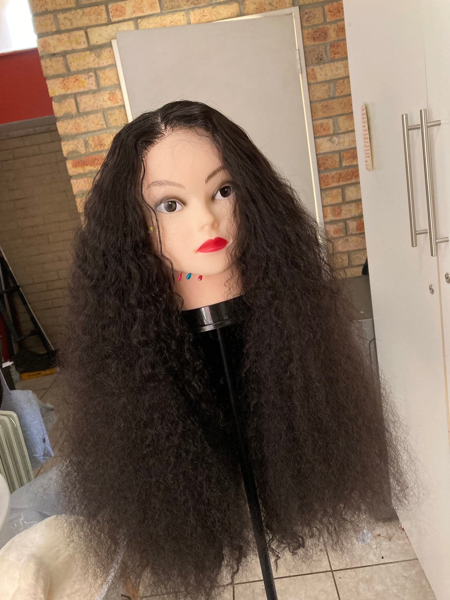 5x5 closure. Black deep wave curls.