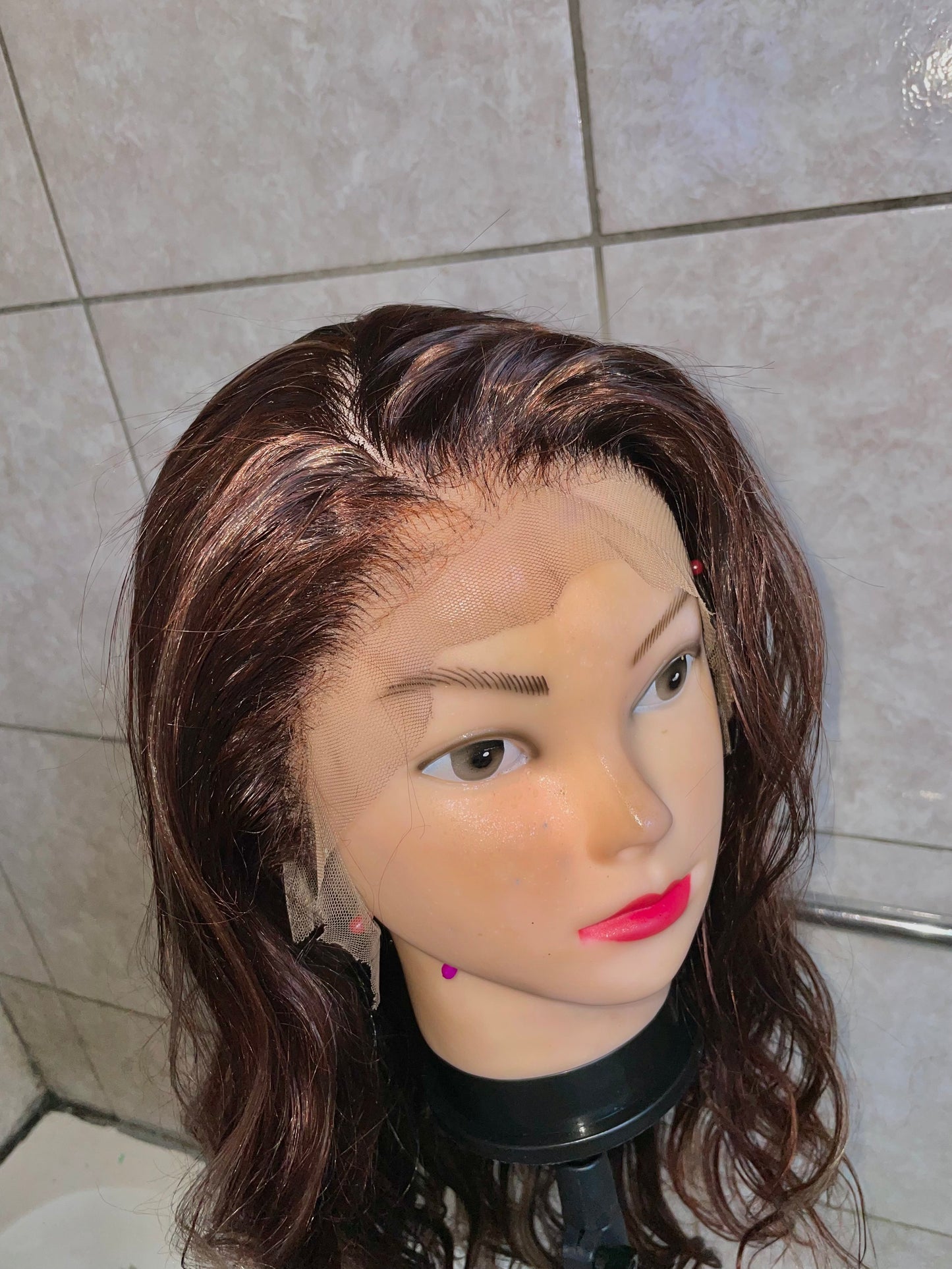 Wavy brown-blonde, blended, 28 inches, 13x4 T-lace.