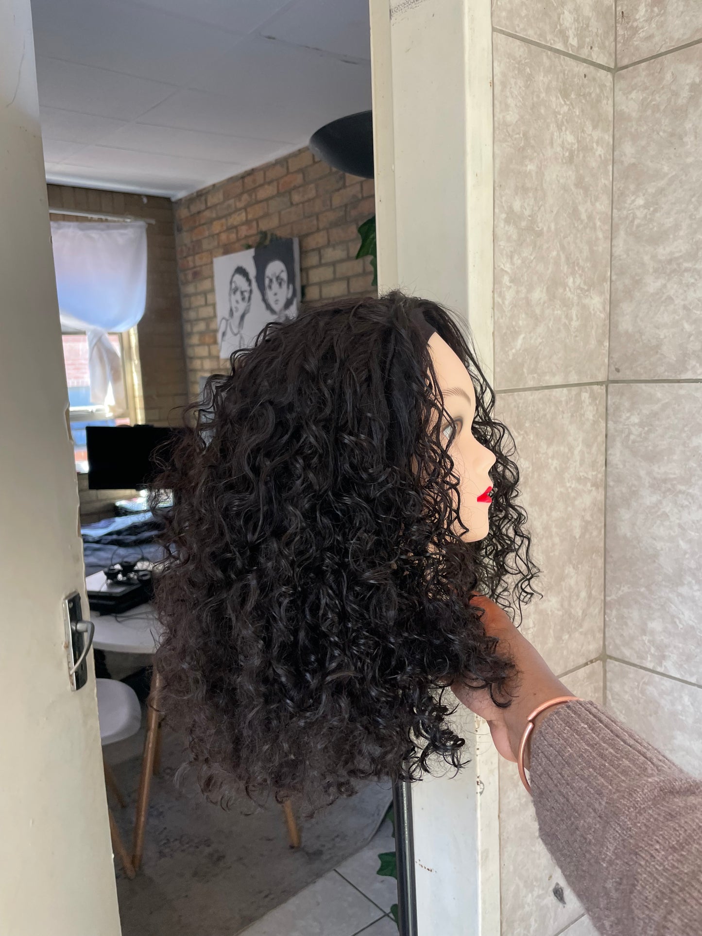 Curly black headband wig.
