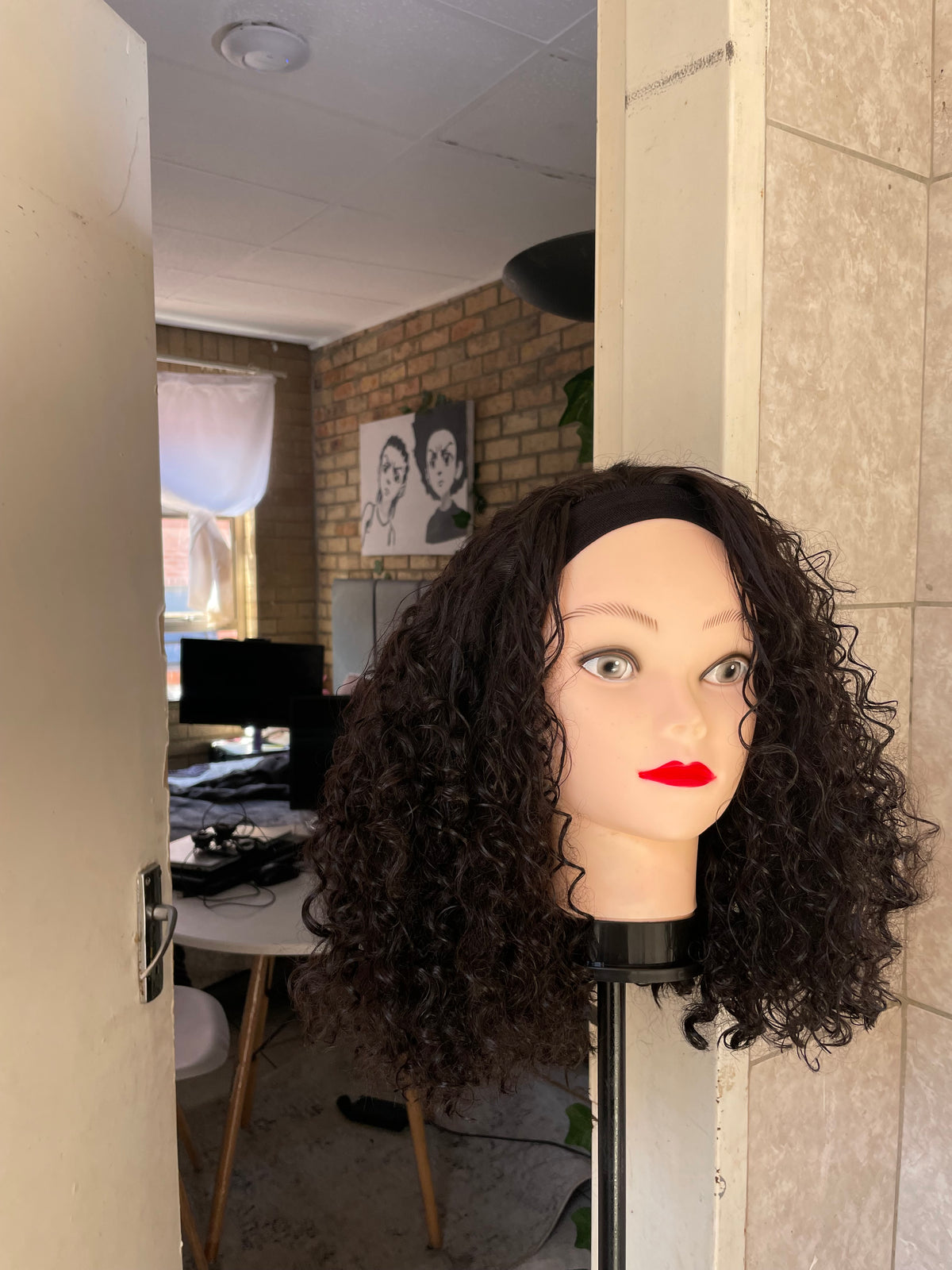 Curly black headband wig.